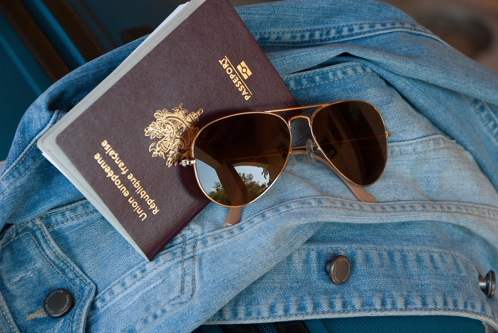 Passport and sunglasses for international travel
